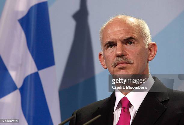 George Papandreou, prime minister of Greece, listens during a news conferencer with Angela Merkel, Germany's chancellor, at the German chancellory in...