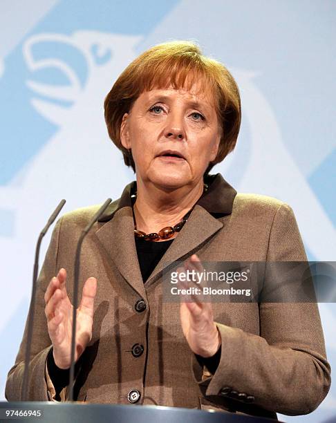 Angela Merkel, Germany's chancellor, speaks during a news conference with George Papandreou, prime minister of Greece, at the German chancellory in...