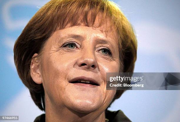 Angela Merkel, Germany's chancellor, speaks during a news conference with George Papandreou, prime minister of Greece, at the German chancellory in...