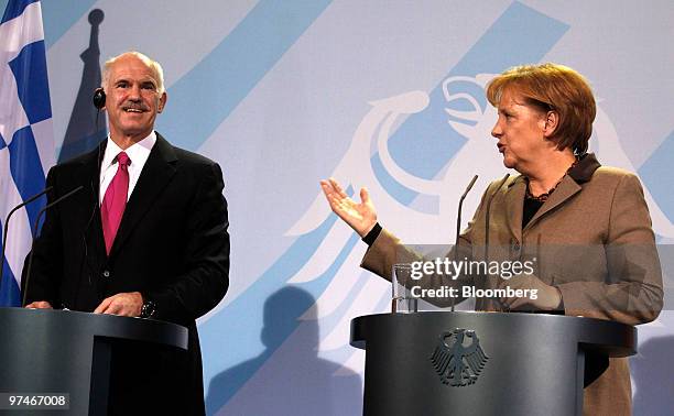 George Papandreou, prime minister of Greece, left,, and Angela Merkel, Germany's chancellor, hold a news conference at the German Chancellory in...