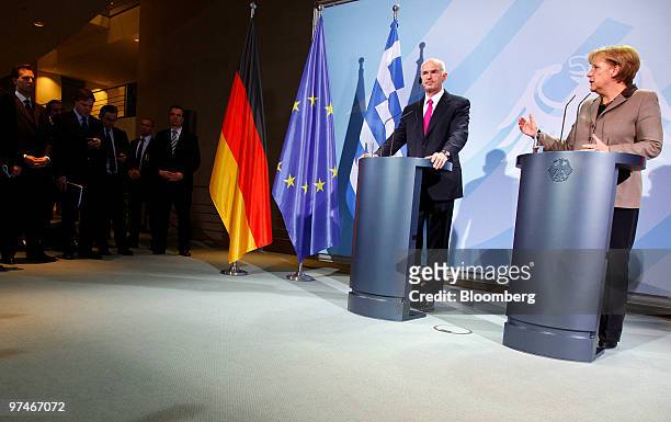George Papandreou, prime minister of Greece, left,, and Angela Merkel, Germany's chancellor, hold a news conference at the German Chancellory in...