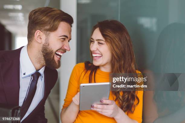 friends in the office using tablet - flirting funny stock pictures, royalty-free photos & images