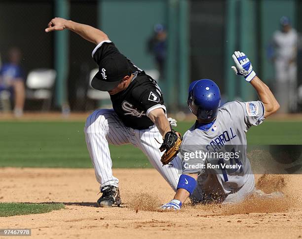 Jamey Carroll of the Los Angeles Dodgers steals second base as Brent Lillibridge of the Chicago White Sox cannot handle the ball on March 5, 2010 at...