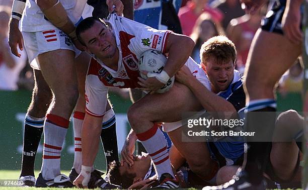 Mark Riddell of the Dragons celebrates after scoring a try during the Round 1 NRL Match between the Sharks and St George Illawarra Dragons played at...