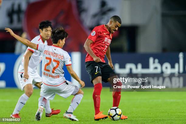 Guangzhou Forward Alan de Carvalho fights for the ball with Jeju FC Forward Ryu Seung-Woo during the AFC Champions League 2018 Group G round 3 match...