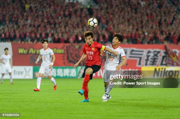 Guangzhou Midfielder Zheng Zhi fights for the ball with Jeju FC Forward Ryu Seung-Woo during the AFC Champions League 2018 Group G round 3 match...