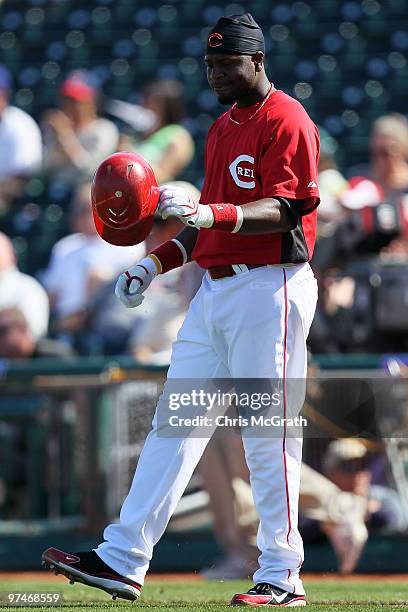 Brandon Phillips of the Cincinnati Reds reacts after being caight out in the fourth inning against the Cleveland Indians during a spring training...