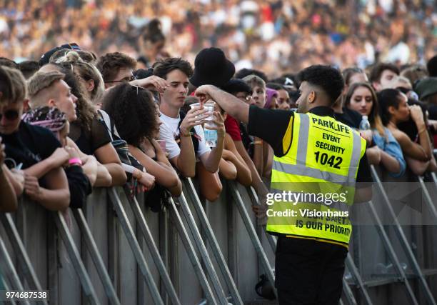 Security stewards hand out water at the Valley stage on day one of the Parklife Festival at Heaton Park on June 9, 2018 in Manchester, England.