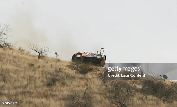 Kimi Raikkonen of Finland and Kaj Lindstrom of Finland keel over in their Citroen C4 Junior Team during the Start of Day 1 of the WRC Rally Mexico...