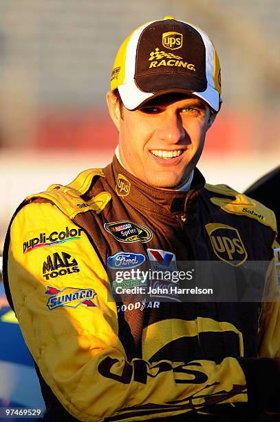 David Ragan, driver of the UPS Ford, stands on the grid during qualifying for the NASCAR Sprint Cup Series Kobalt Tools 500 at Atlanta Motor Speedway...