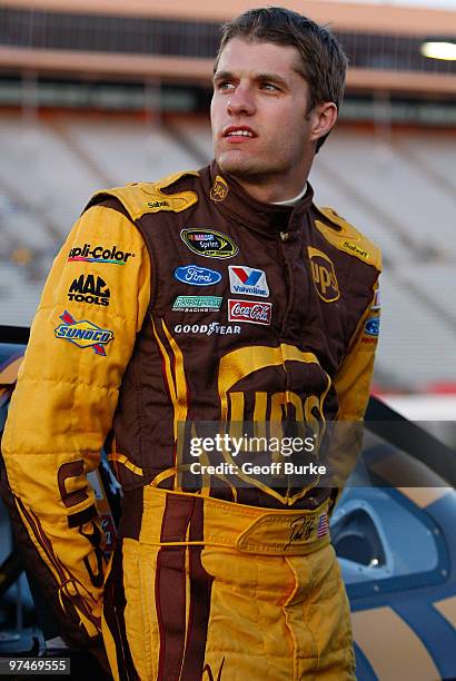 David Ragan, driver of the UPS Ford, stands on the grid during qualifying for the NASCAR Sprint Cup Series Kobalt Tools 500 at Atlanta Motor Speedway...