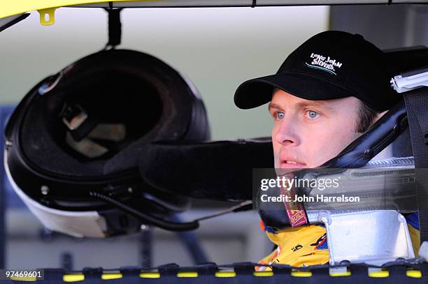 Travis Kvapil, driver of the Long John Sliver's Ford, sits in his car during qualifying for the NASCAR Sprint Cup Series Kobalt Tools 500 at Atlanta...