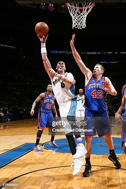 Mike Miller of the Washington Wizards goes to the basket against David Lee of the New York Knicks during the game on February 26, 2010 at the Verizon...