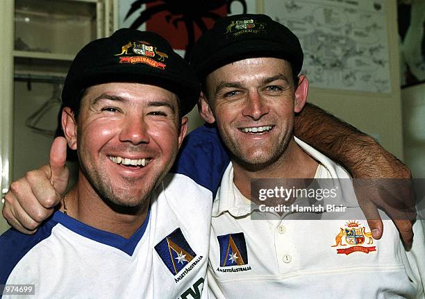 Ricky Ponting, vice captain and Adam Gilchrist, captain of Australia celebrate their five wickets over the West Indies during the fifth days play of...