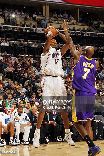 Lamar Odom of the Los Angeles Lakers blocks against Tyrus Thomas of the Charlotte Bobcats on March 5, 2010 at the Time Warner Cable Arena in...