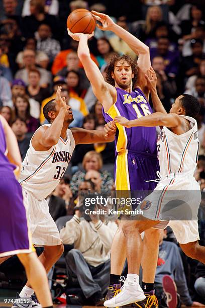 Pau Gasol of the Los Angeles Lakers looks for the pass against Boris Diaw of the Charlotte Bobcats on March 5, 2010 at the Time Warner Cable Arena in...