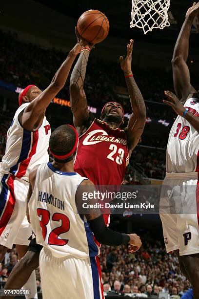 LeBron James of the Cleveland Cavaliers goes up for the shot surrounded by Charlie Villanueva, Richard Hamilton and Kwame Brown of the Detroit...