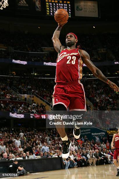 LeBron James of the Cleveland Cavaliers glides in for the fast break dunk against the Detroit Pistons on March 5, 2010 at The Quicken Loans Arena in...