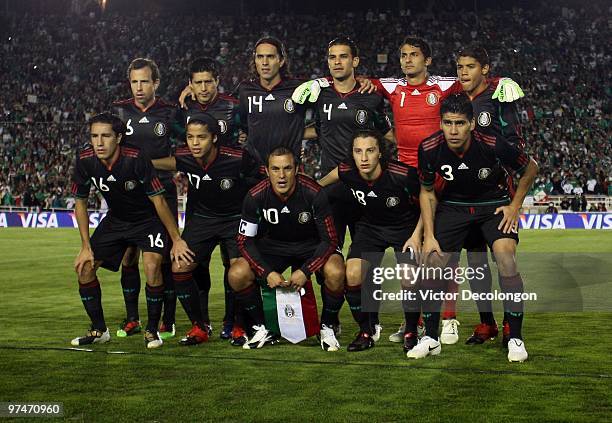 The starting line-up for Mexico pose for a team photo prior to their International Friendly match against New Zealand at the Rose Bowl on March 3,...