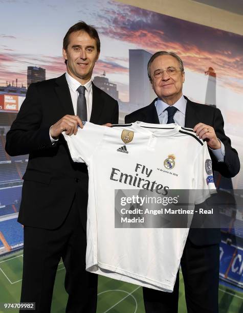 New Real Madrid head coach Julen Lopetegui poses with president Florentino Perez during his presentation at Santiago Bernabeu stadium on June 14,...