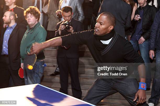 Jamie Foxx plays ping-pong at the Pre-Oscar Ping Pong party hosted by Susan Sarandon and Spin New York at Mondrian Hotel on March 4, 2010 in West...