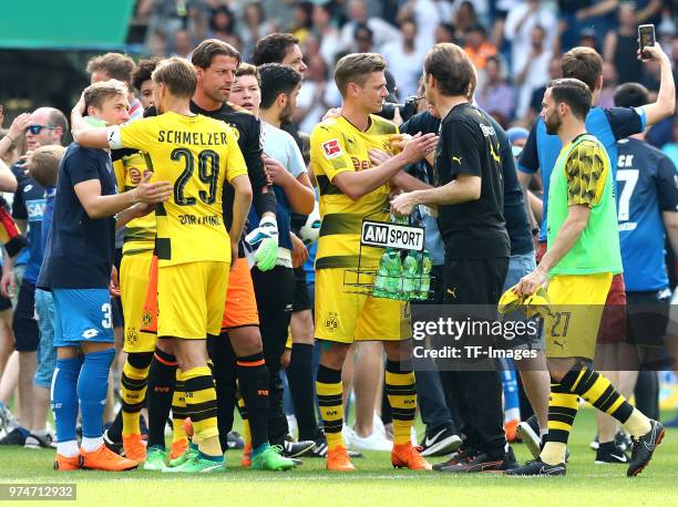 Felix Passlack of Hoffenheim and Marcel Schmelzer of Dortmund, Goalkeeper Roman Weidenfeller of Dortmund, Lukasz Piszczek of Dortmund and Dr. Markus...