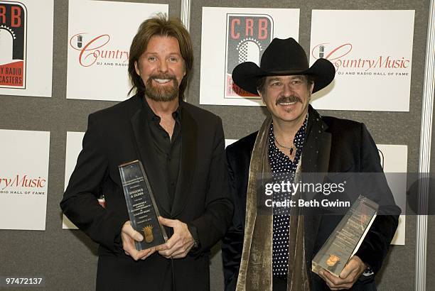 Ronnie Dunn and Kix Brooks of Brooks & Dunn attend the Country Radio Seminar dinner and ceremony at the Country Music Hall of Fame on February 23,...