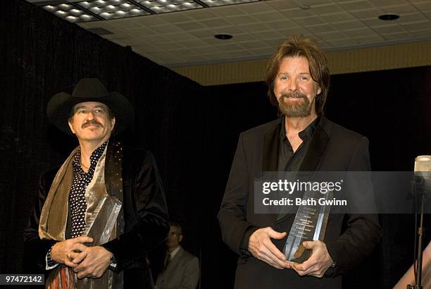 Kix Brooks and Ronnie Dunn of Brooks & Dunn attend the Country Radio Seminar dinner and ceremony at the Country Music Hall of Fame on February 23,...