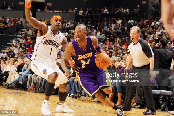 Kobe Bryant of the Los Angeles Lakers drives toward the basket against Stephen Jackson of the Charlotte Bobcats on March 5, 2010 at the Time Warner...