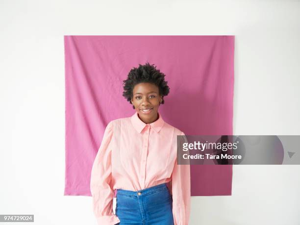 woman standing in front of purple background
