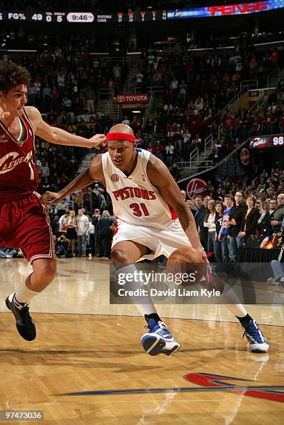 Charlie Villanueva of the Detroit Pistons drives to the basket against Anderson Varejao of the Cleveland Cavaliers on March 5, 2010 at The Quicken...