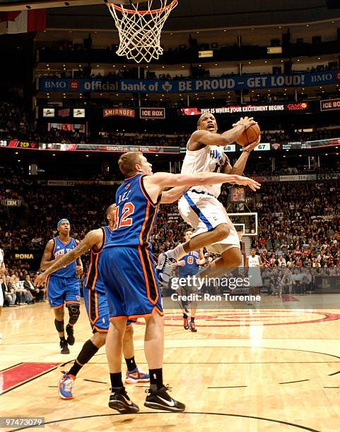 DeMar DeRozan of the Toronto Raptors drives hard to the basket defended by David Lee of the New York Knicks during a game on March 05, 2010 at the...