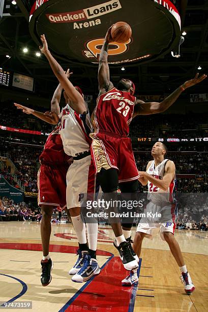 LeBron James of the Cleveland Cavaliers pulls down the rebound against Charlie Villanueva of the Detroit Pistons on March 5, 2010 at The Quicken...