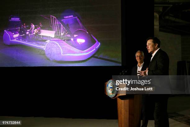 Chicago Mayor Rahm Emanuel listens to engineer and tech entrepreneur Elon Musk of The Boring Company talks about constructing a high speed transit...