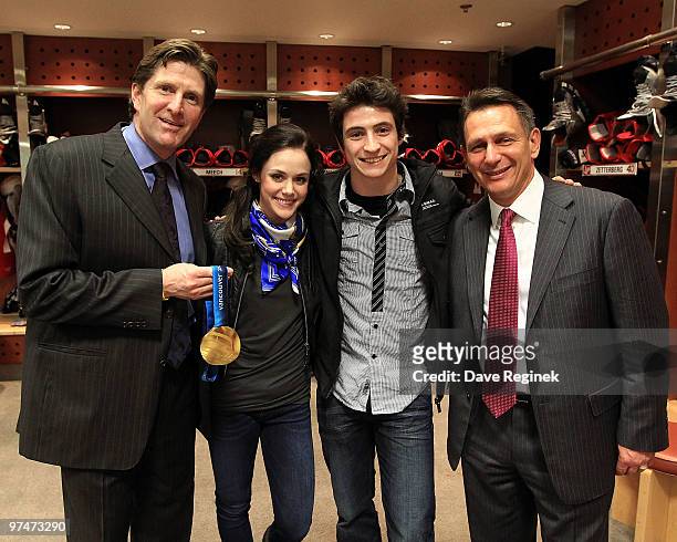 After the Detroit Red Wings 5-2 win against the Nashville Predators, Coach Mike Babcock poses with 2010 Olympic Gold Medalists' Tessa Virtue & Scott...