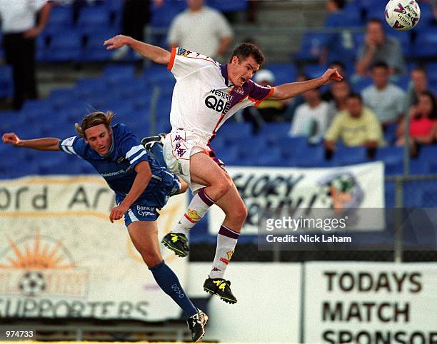 Damon Collina of Sydney Olympic and Alistair Edwards of Perth Glory clash after attempting to head the ball during the NSL Round 16 match between...