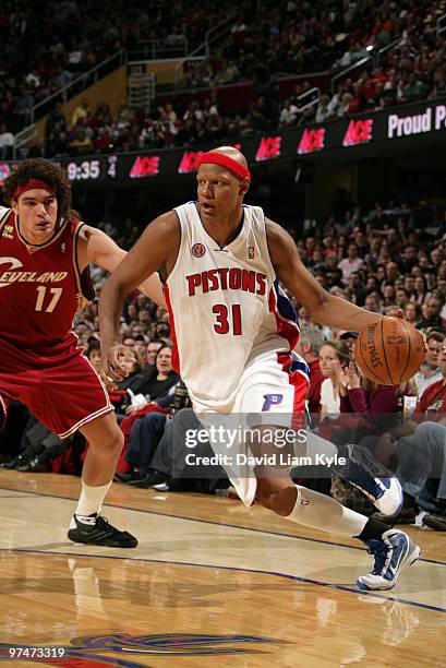 Charlie Villanueva of the Detroit Pistons drives to the basket against Anderson Varejao of the Cleveland Cavaliers on March 5, 2010 at The Quicken...