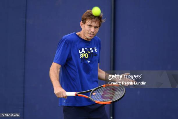 Nicolas Mahut of France hits a backhand in practice during preview Day 2 of the Fever-Tree Championships at Queens Club on June 14, 2018 in London,...