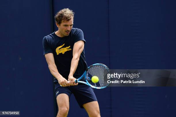 Julien Benneteau of France hits a backhand in practice during preview Day 2 of the Fever-Tree Championships at Queens Club on June 14, 2018 in...