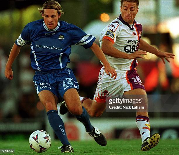 Damon Collina of Sydney Olympic is chased down by Damian Mori of the Perth Glory in during the NSL Round 16 match between Sydney Olympic and Perth...