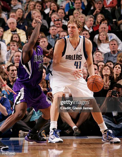 Dirk Nowitzki of the Dallas Mavericks posts up against Donte Greene of the Sacramento Kings during a game at the American Airlines Center on March 5,...