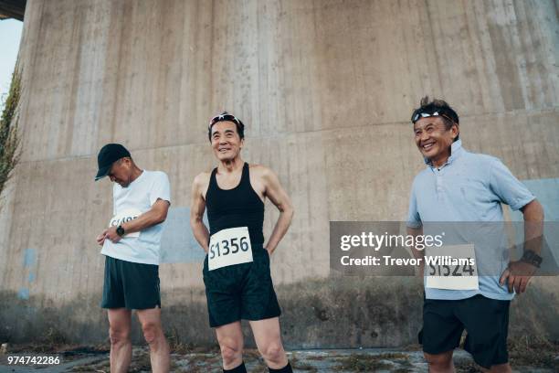 three senior men preparing to run a marathon - 3 old men jogging stock pictures, royalty-free photos & images