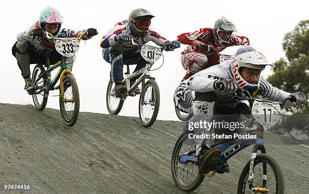 Alex Cameron of NSW, Frank Penrose of NSW and Matthew Juster of NT try to catch Luke Madill of NSW in the Probikx Elite Men's group during the BMX...