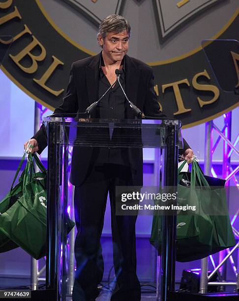 Actor George Clooney playfully spoofs Sarah Palin with some gift bags at the 47th Annual ICG Publicist Awards at the Hyatt Regency Century Plaza on...