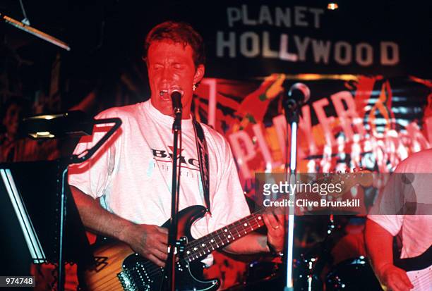 Pat Cash of Australia performs on his guitar at the Planet Hollywood Players Party at Planet Hollywood, Leicester Square, London. Mandatory Credit:...