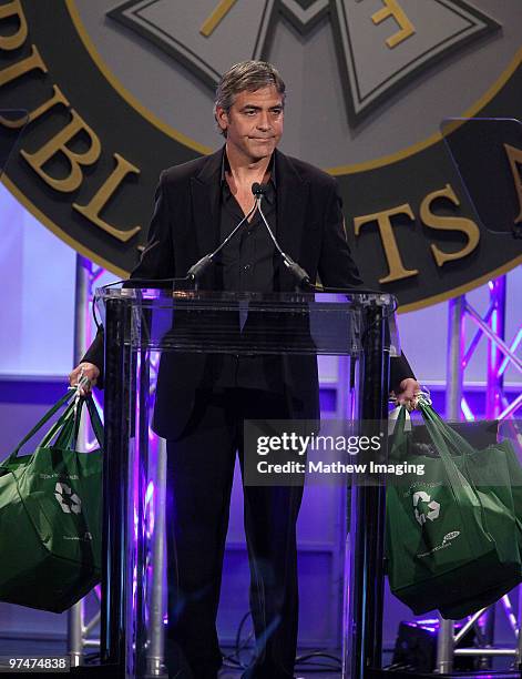 Actor George Clooney playfully spoofs Sarah Palin with some gift bags at the 47th Annual ICG Publicist Awards at the Hyatt Regency Century Plaza on...