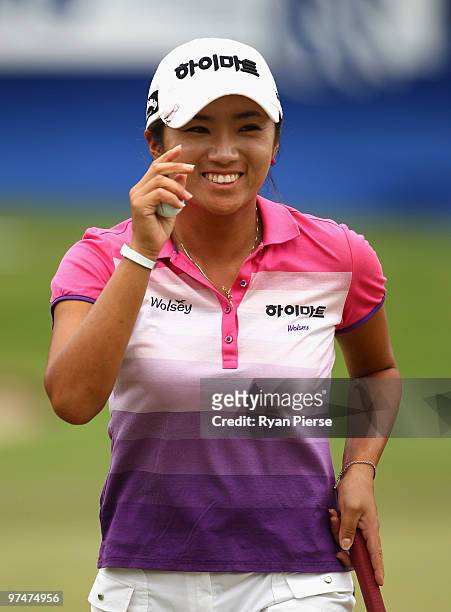 Bo-Mee Lee of Korea thanks the crowd after scoring a birdie on the 18th hole during round three of the 2010 ANZ Ladies Masters at Royal Pines Resort...