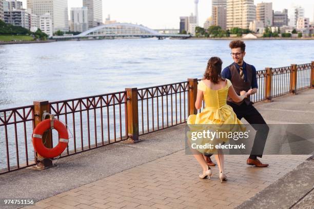 couple dancing at sunset - swing dancing stock pictures, royalty-free photos & images