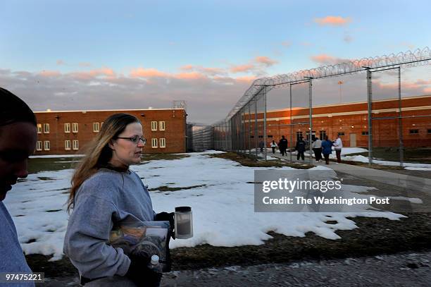 Christine Foote of Salisbury, MD, makes her way to her job at "Data Entry" as the sun begins to rise at the Maryland Correctional Institute for Women...