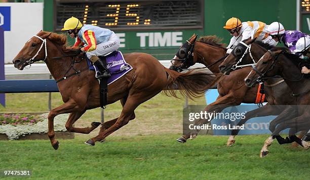 Sam Spratt riding Star Of Kings wins race 7 The Gucci Mile during the Telecom Derby Day meeting at Ellerslie Racecourse on March 6, 2010 in Auckland,...